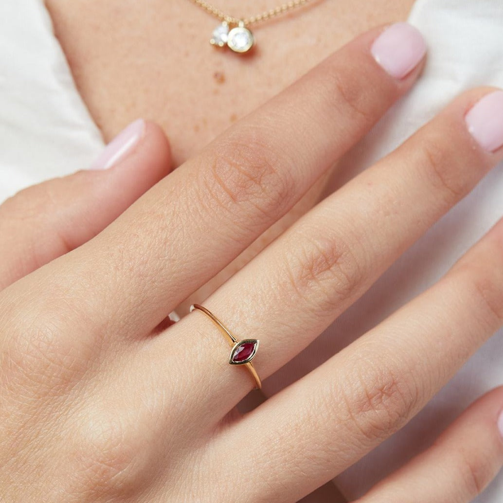 The hummingbird ring with a marquise-cut ruby stone