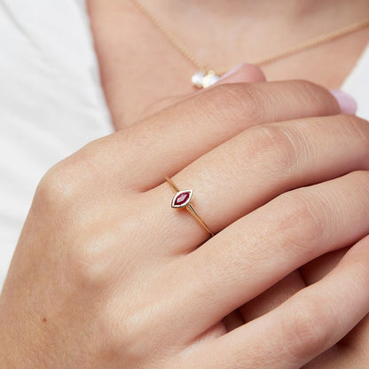 The hummingbird ring with a marquise-cut ruby stone