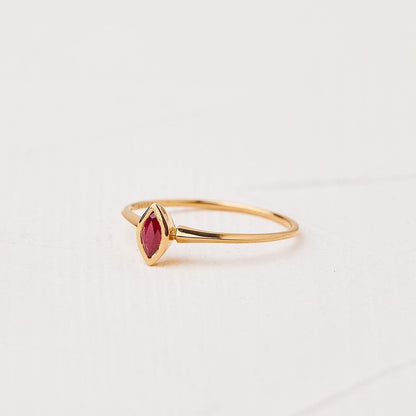 The hummingbird ring with a marquise-cut ruby stone