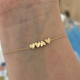Gold Bracelet With Heart Pendants