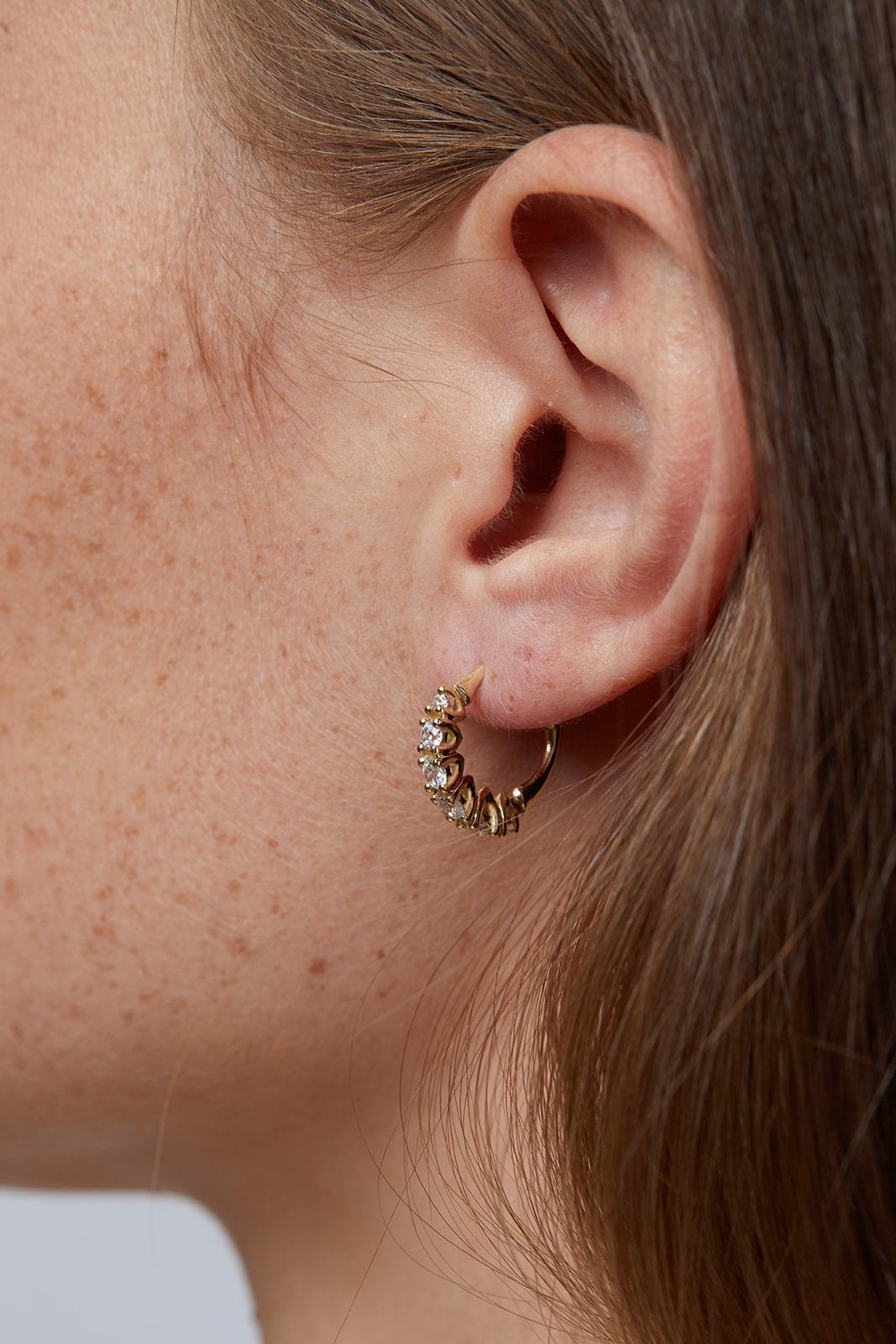 Olive tree earrings studded with natural diamonds