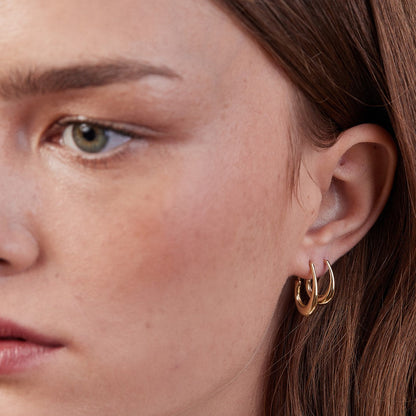 Gold pear hoop earring