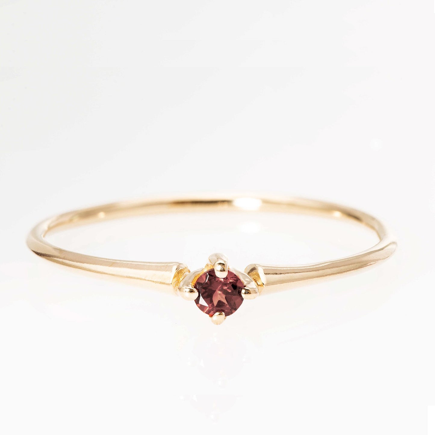 Poppy ring with burgundy sapphire