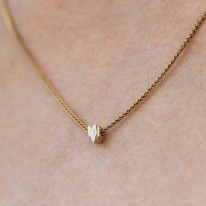 Gold necklace with cyclamen pendant