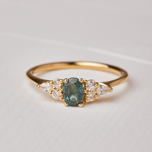 Iris ring set with turquoise sapphires and diamonds