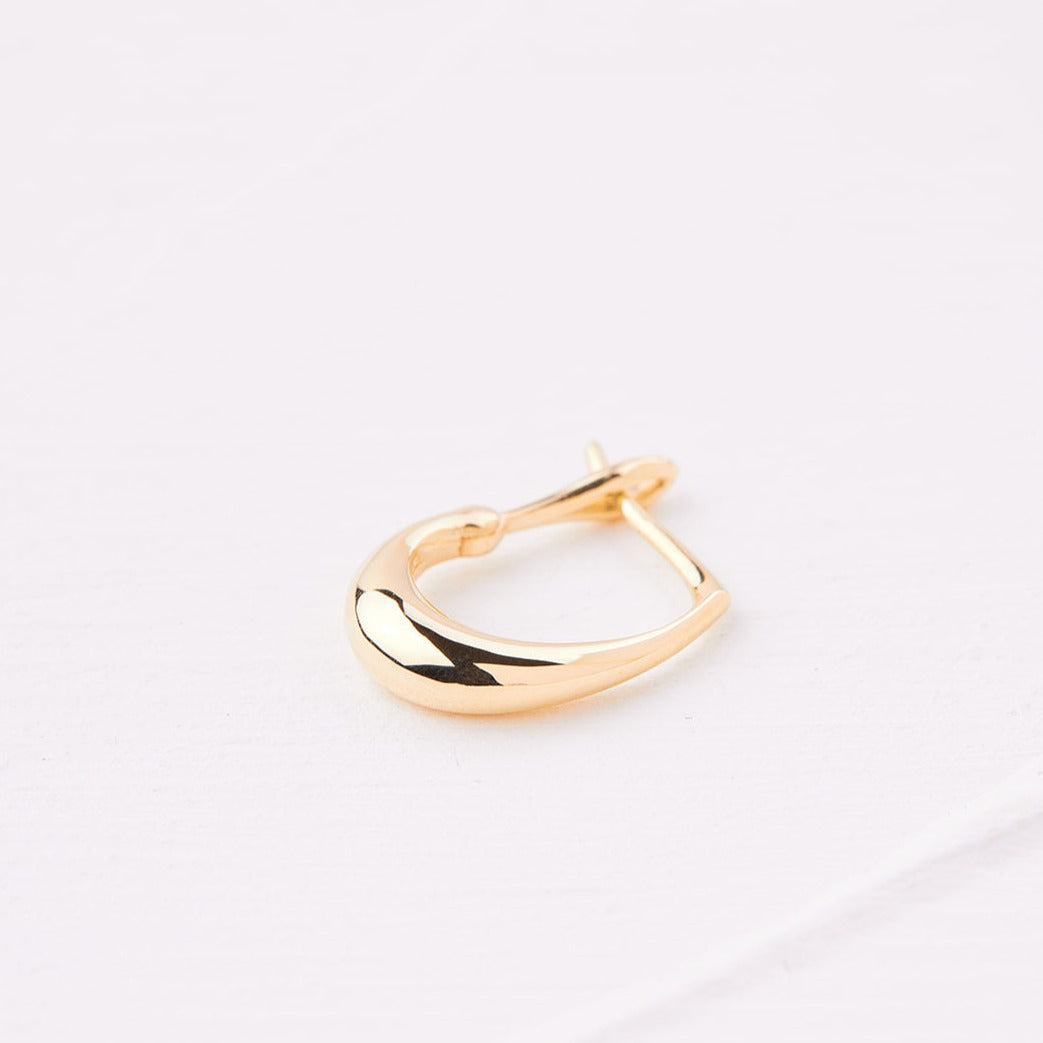 Gold pear hoop earring