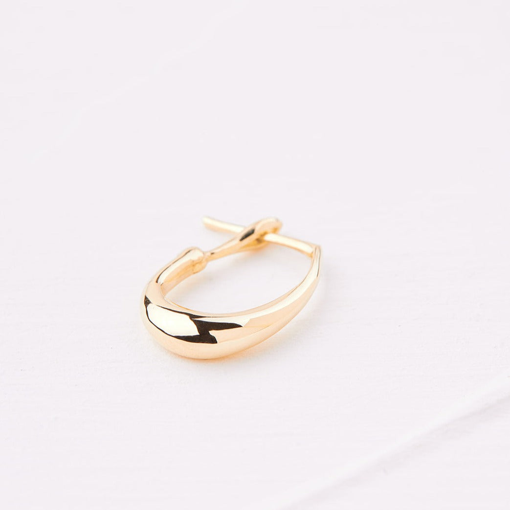 Gold pear hoop earring