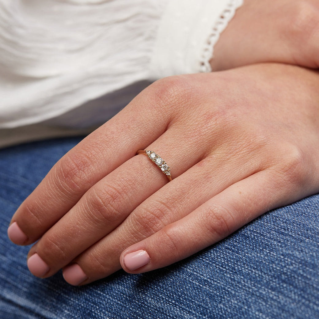 A ripple ring with a center stone of a tenth of a carat of laboratory diamonds