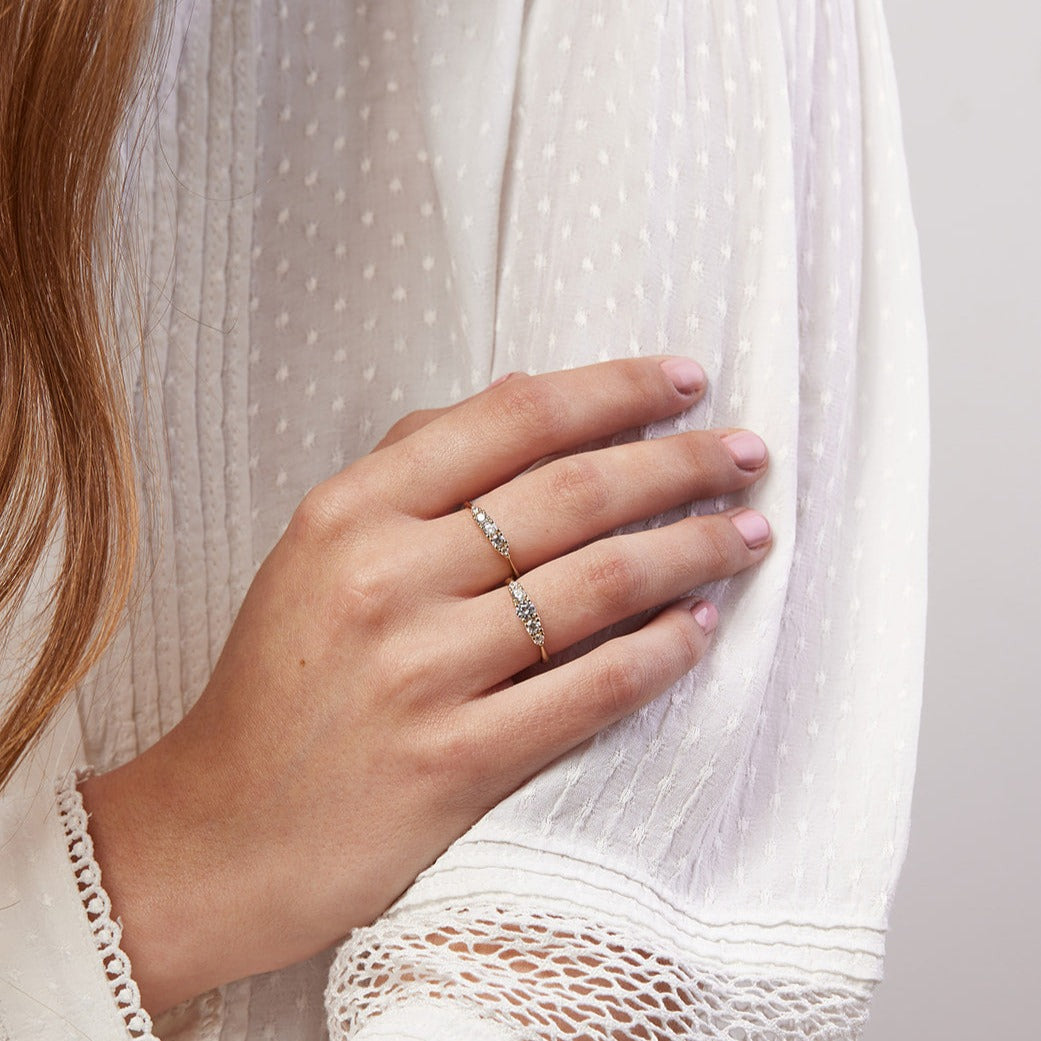 A ripple ring with a center stone of a tenth of a carat of laboratory diamonds