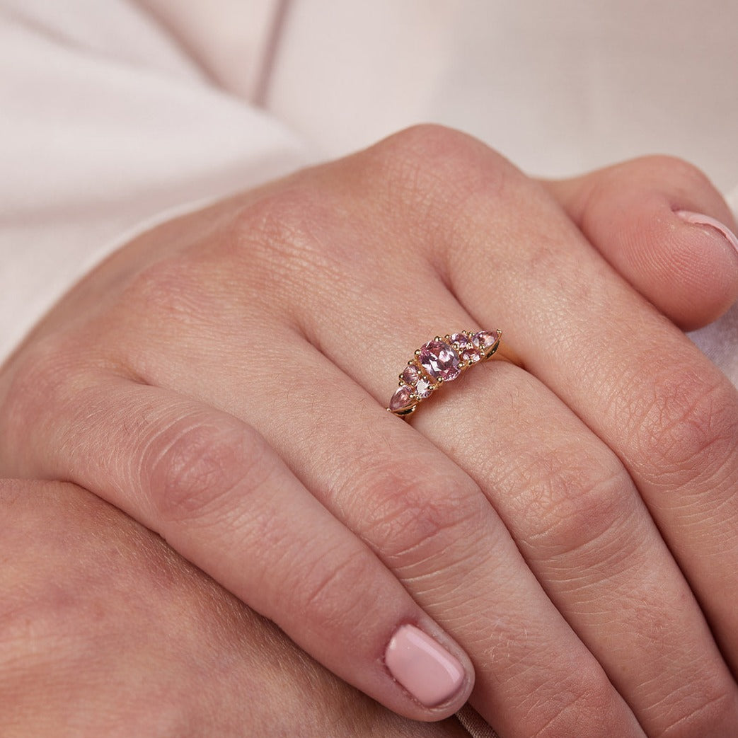 An engagement ring studded with pink sapphires