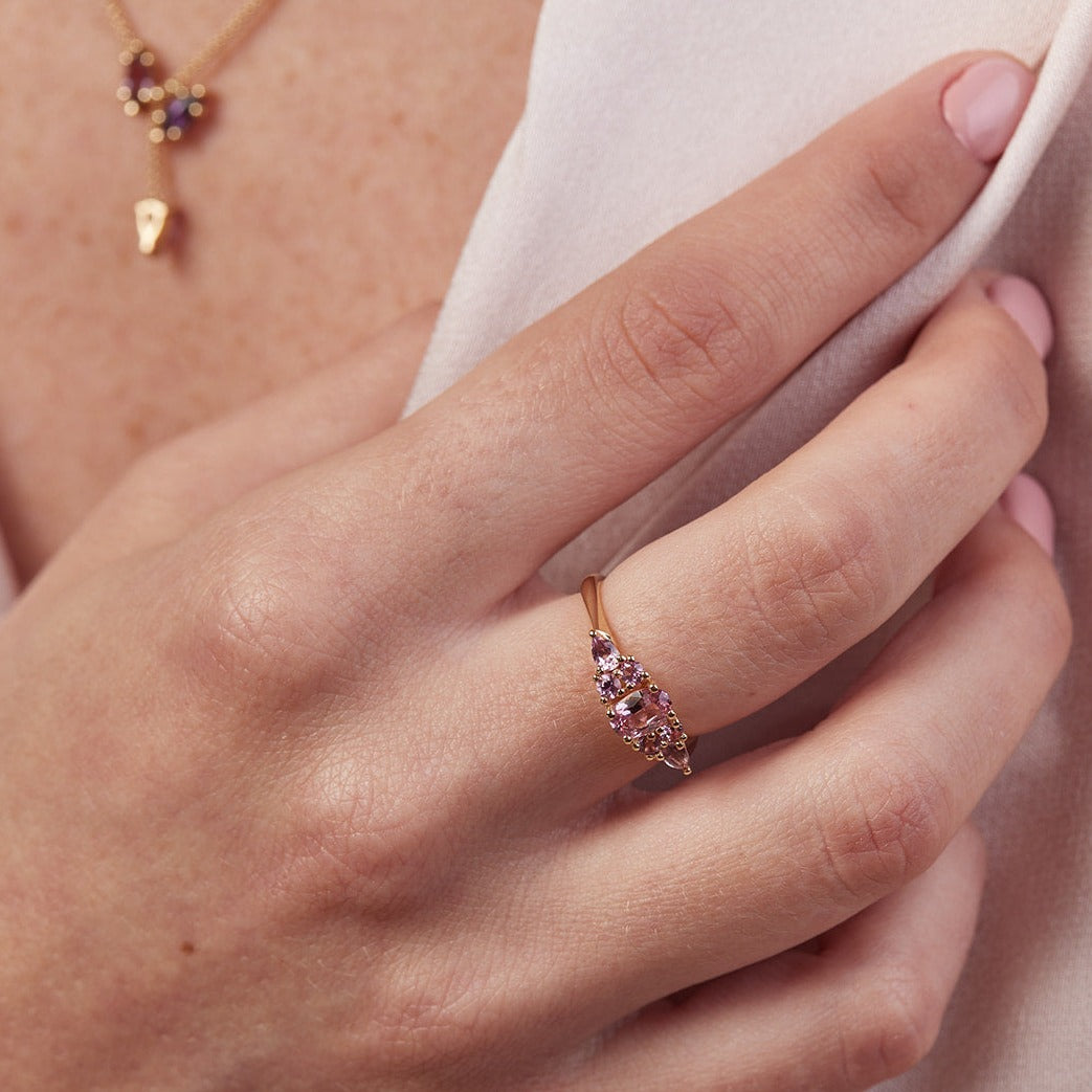 An engagement ring studded with pink sapphires