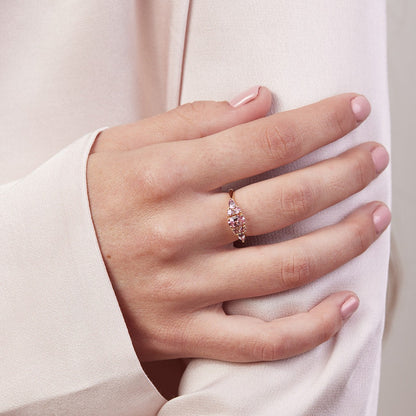 An engagement ring studded with pink sapphires