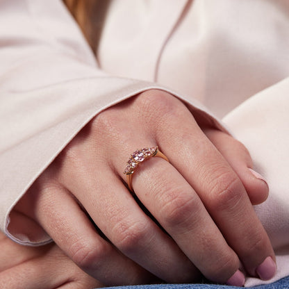 An engagement ring studded with pink sapphires