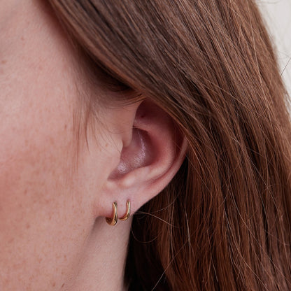 Small gold hoop piercing